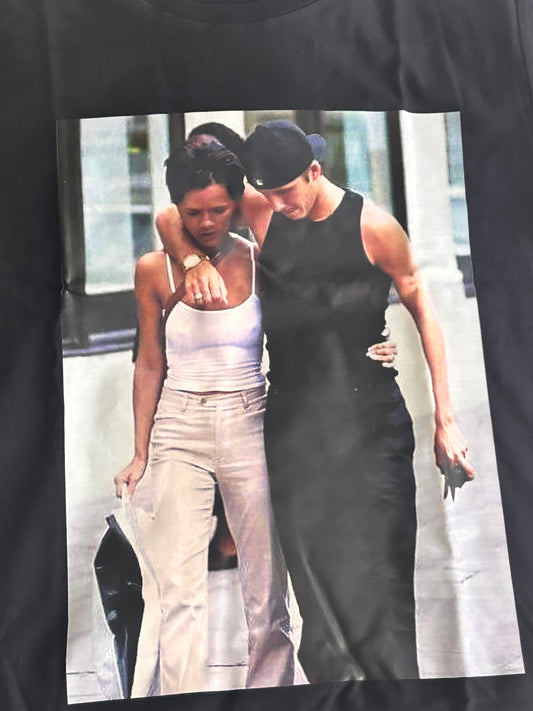 David & Victoria Beckham Black Graphic T-Shirt โ Celebrity Style & Pop Culture Streetwear